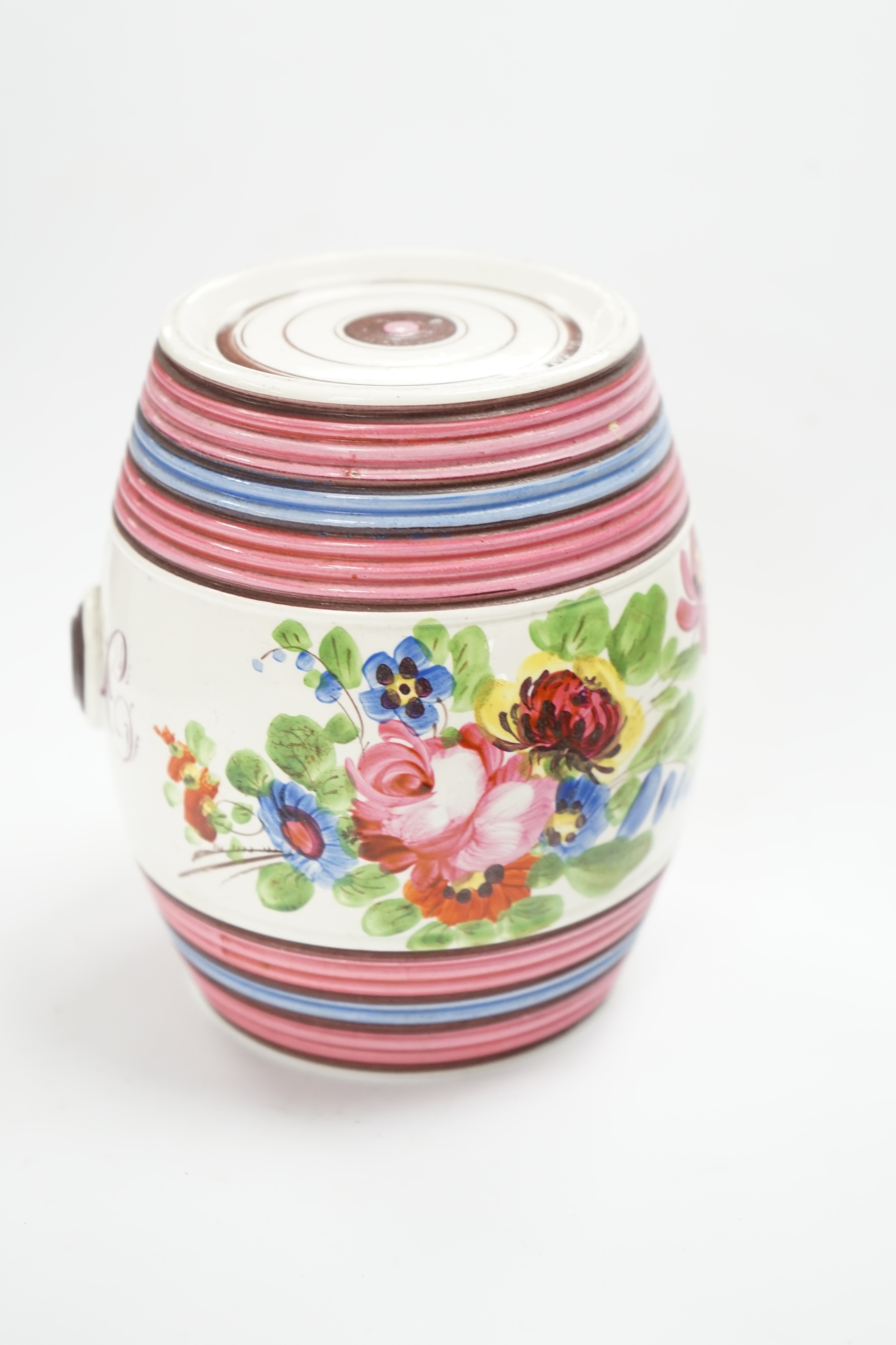 A small Victorian dated spirit barrel dated 1834, decorated with flowers and a monogram, 12cm high. Condition - good